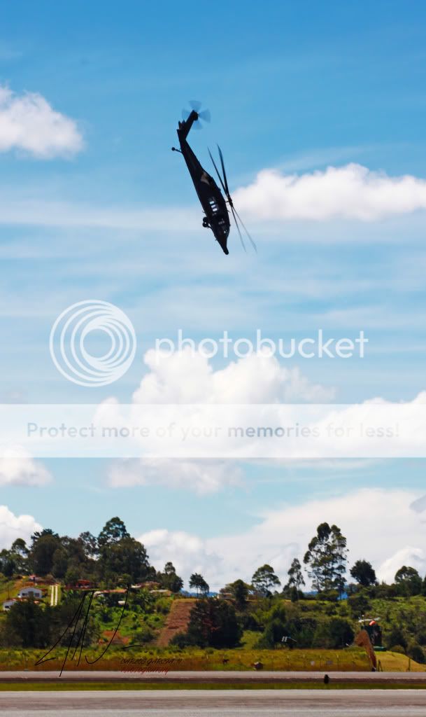 IMAGE: http://i919.photobucket.com/albums/ad35/surgeonhawkeye/F%20Air%202011/Fair20111535UH60dive.jpg